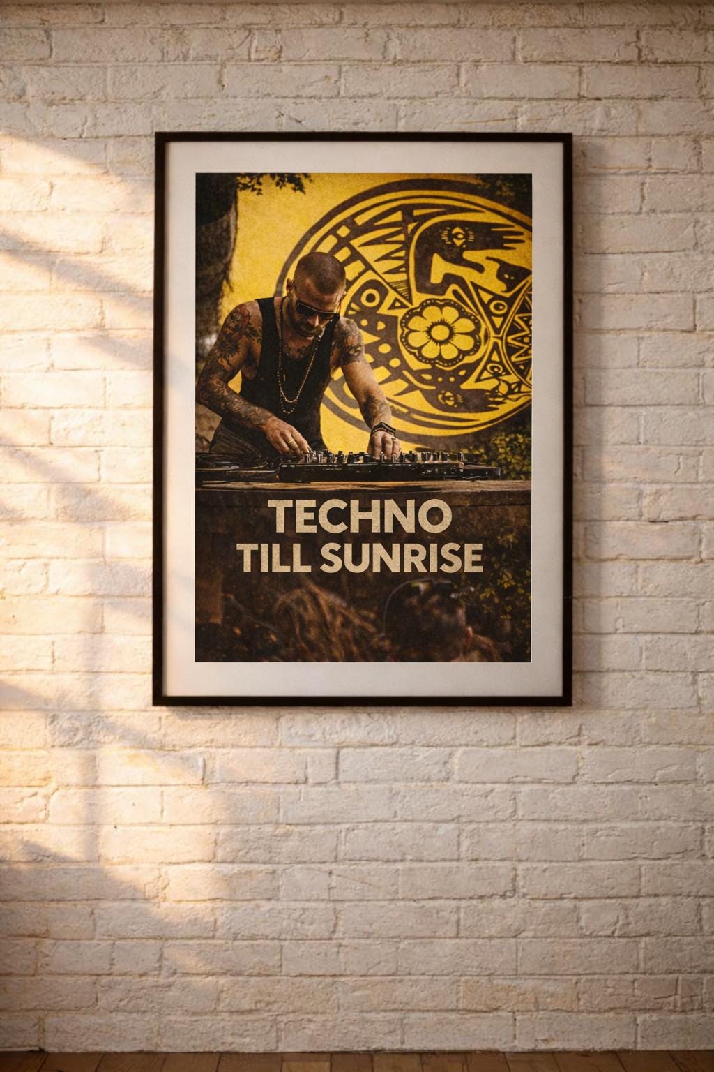 May include: A framed poster with a black border, featuring a DJ at a music event. The poster has a yellow and black background with a tribal design. The text "TECHNO TILL SUNRISE" is displayed prominently.